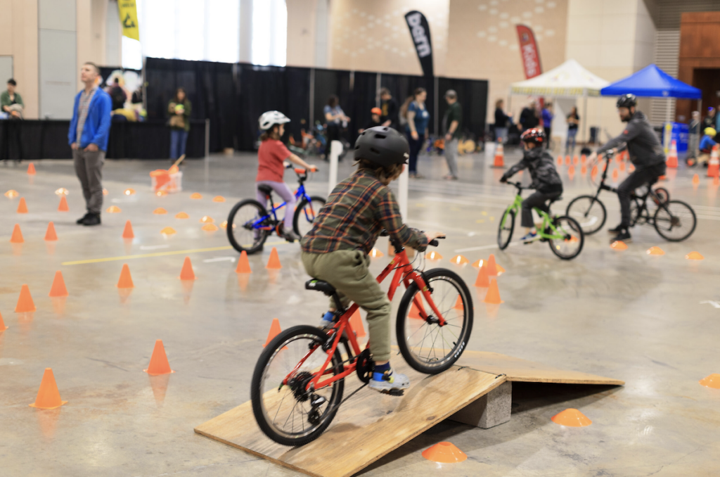 A child rides a bike at the Philly Bike Expo