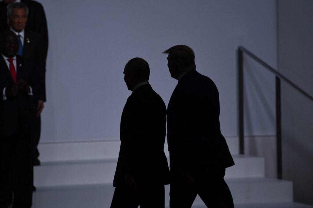 Donald Trump walking in the mist with Vladimir Putin