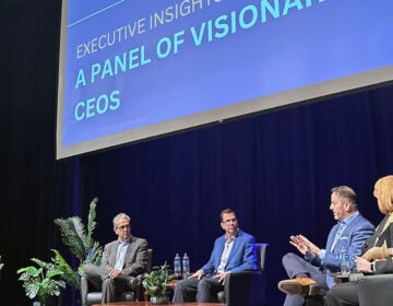 Wawa CEO Chris Gheysens speaks to a number of other CEOs on a stage at West Chester University