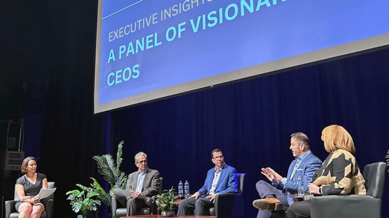 Wawa CEO Chris Gheysens speaks to a number of other CEOs on a stage at West Chester University