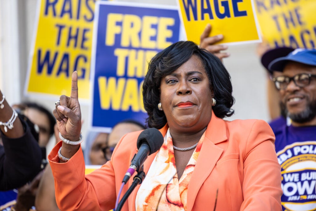 Cherelle Parker speaking at a podium at the rally