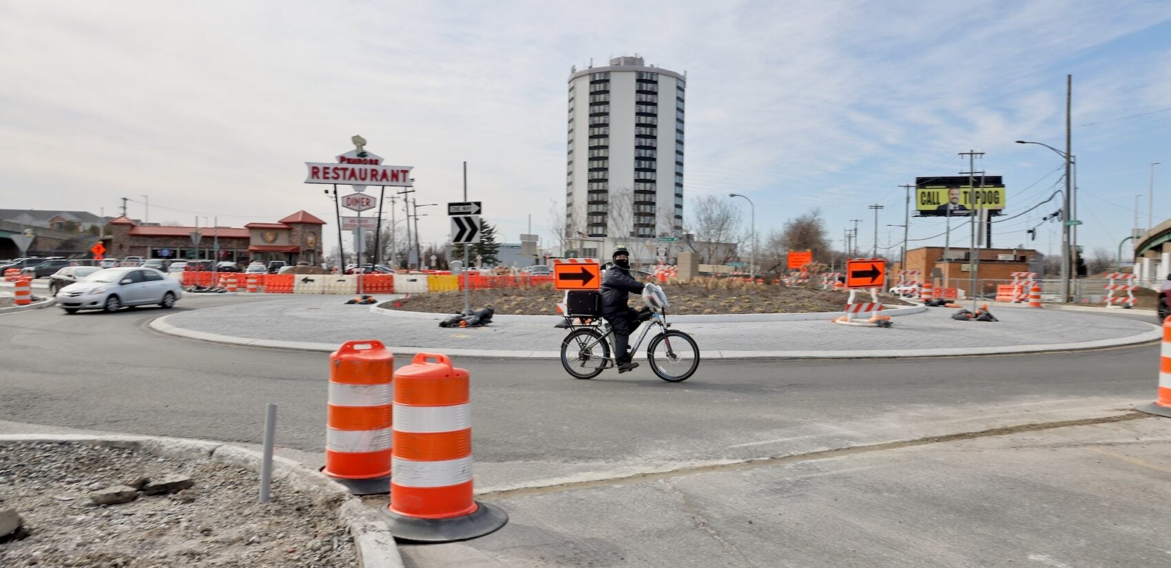 2025 02 18-e lee-philadelphia penrose roundabout-traffic calming bicycle A cyclist breezes through the Penrose Roundabout