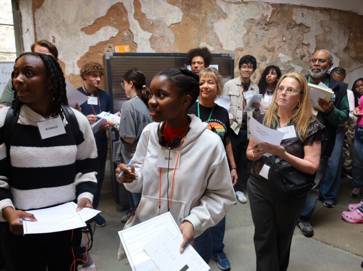 Attendees navigate different tasks during the Eastern State Penitentiary’s Reentry Simulation