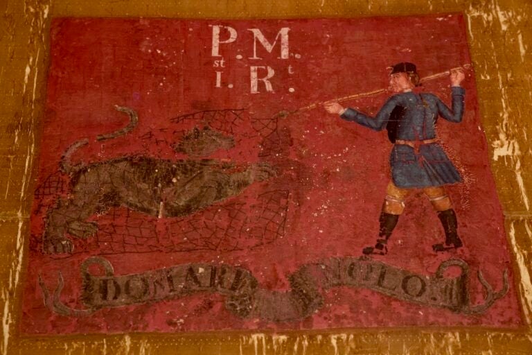 The flag of the 1st Continental Regiment on display at the Museum of the American Revolution
