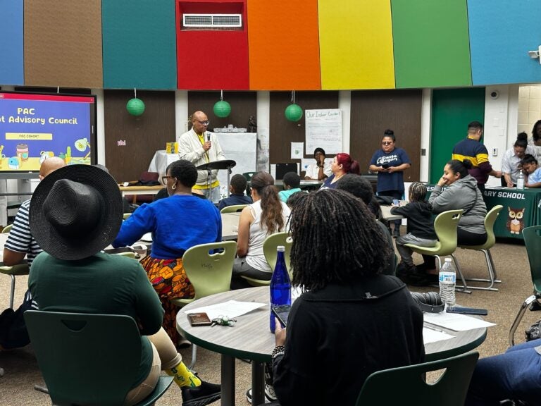 Parents and students build a library at Forest Hill family school in Camden New Jersey to discuss district cuts to fill a $91 million deficit.