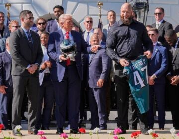 Lane Johnson presents Donald Trump with an Eagles Jersey with his name on it at the White House ceremony