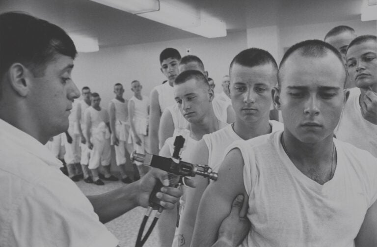 immunizations-navy-1965 Navy recruits in 1965 wait in line for immunizations