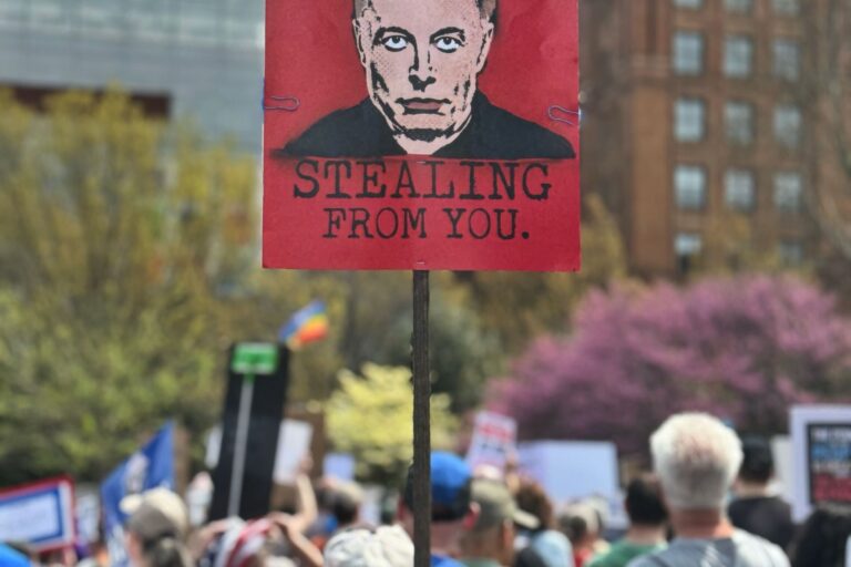 A sign at a protest against the Trump administration in Philadelphia reads 