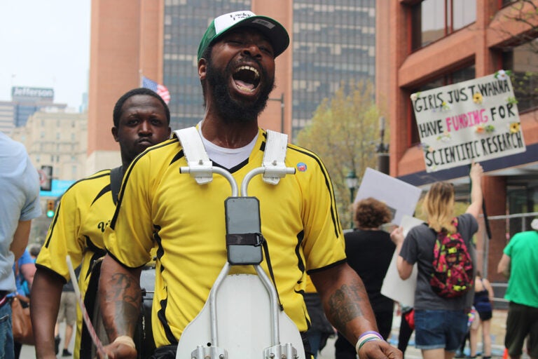 A drumline participates in a rally in Philadelphia protesting the Trump administration