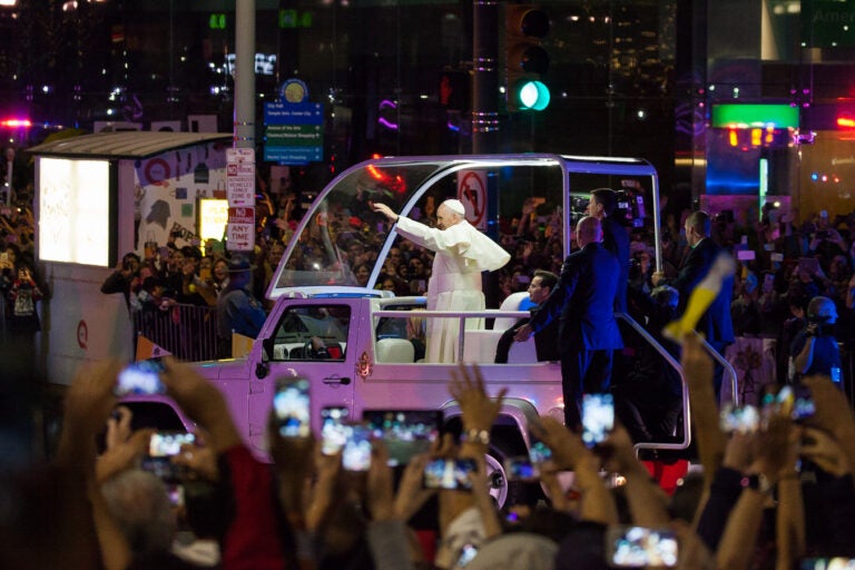 Pope Francis waves to the crowd