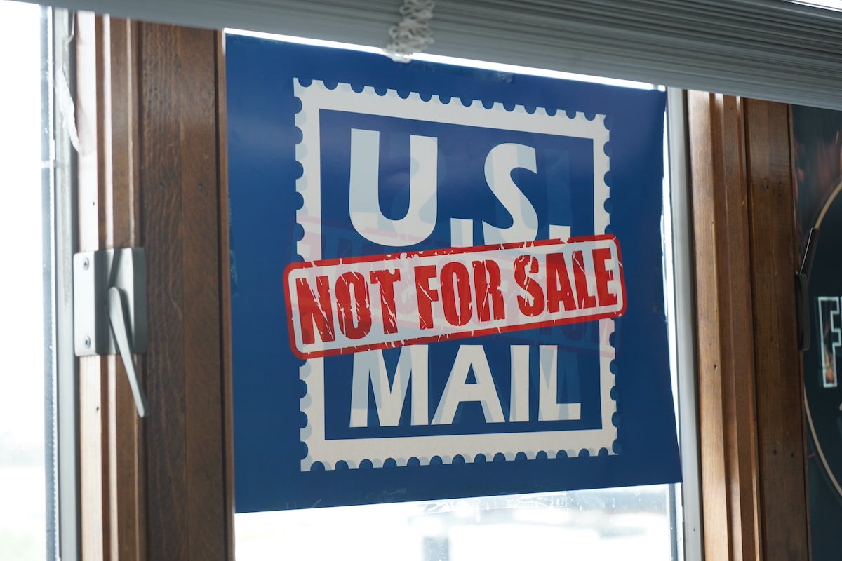 postal-workers-union-stand-against-trump-administration-KC-042525-06 Protest signs opposing the idea of privatizing the Postal Service