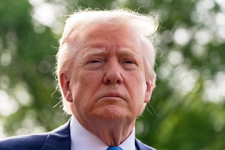 Trump President Donald Trump speaks with reporters
