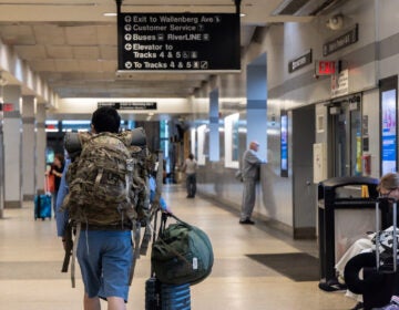 Passengers wait for Amtrak trains at the Trenton Transit Center