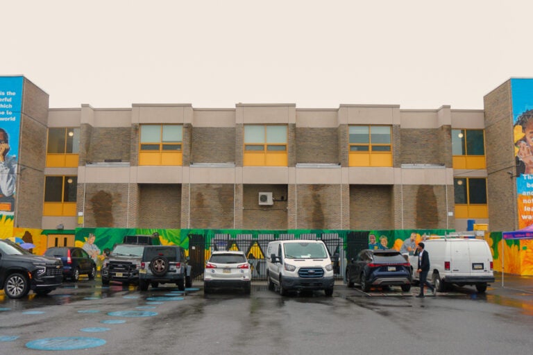 two part of a mural on left and right sides of the school