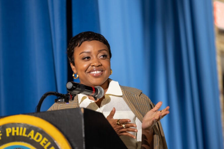 Quinta Brunson speaks behind a podium