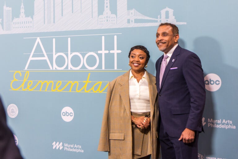 Quinta Brunson poses with Tony Watlington