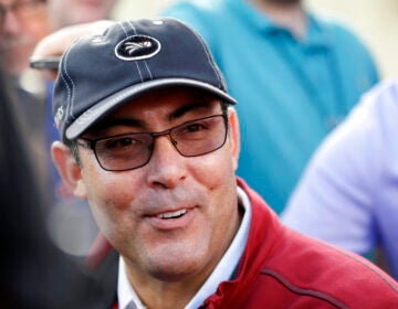 In this Feb. 13, 2014, file photo, Philadelphia Phillies' general manager Ruben Amaro Jr. speaks to reporters before a spring training baseball practice in Clearwater, Fla. (AP Photo/Charlie Neibergall)