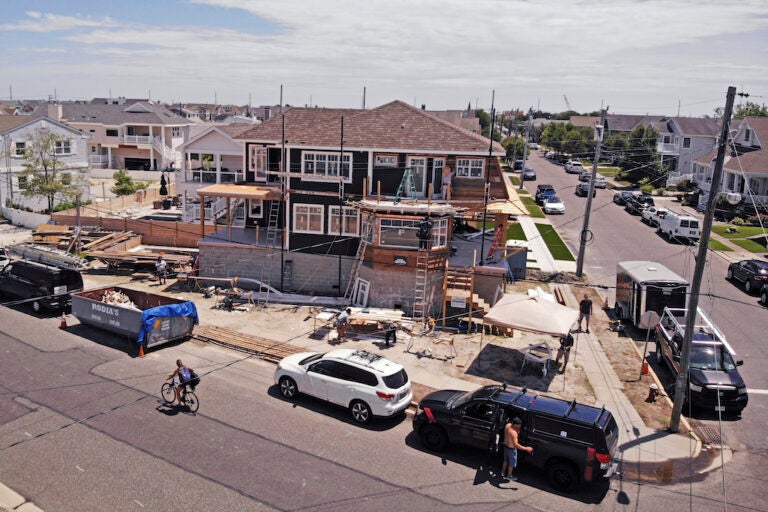 New Home Housing Construction In this image from a drone, workers construct a new house elevated with cinder blocks in Stone Harbor, New Jersey, on Thursday, July 23, 2020. (AP Photo/Ted Shaffrey)