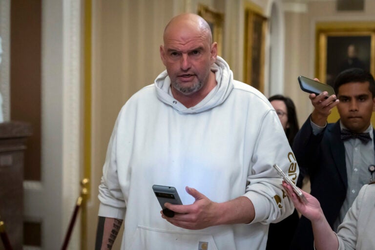 Congress Budget Sen. John Fetterman, D-Pa., speaks to reporters as he walks near the Senate chamber at the Capitol in Washington. (AP Photo/Ben Curtis)