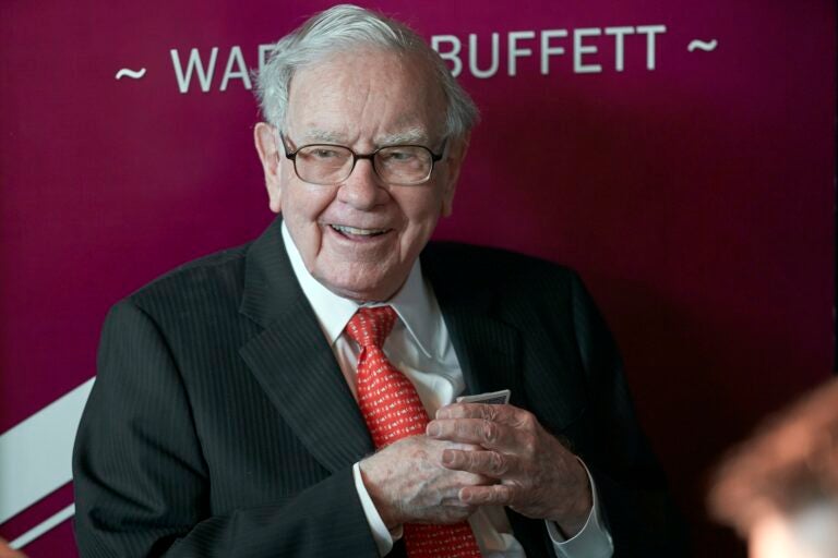 Warren Buffett, chairman and CEO of Berkshire Hathaway, smiles as he plays bridge following the annual Berkshire Hathaway shareholders meeting in Omaha, Neb. (AP Photo/Nati Harnik, File)