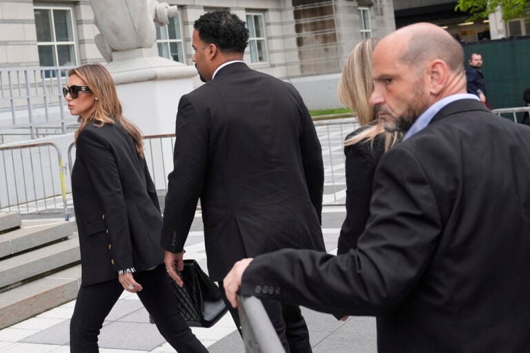 Immigration Protest Mayor Arrest Interim US Attorney for New Jersey Alina Habba walks with men dressed in suits