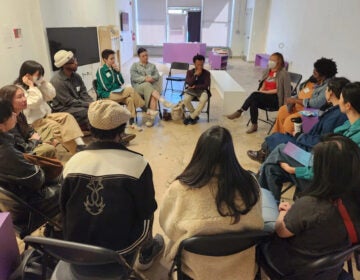 Attendees participate in a workshop at the Afro-Asian Solidarity Symposium at the Asian Arts Initiative's exhibit, Crescendo