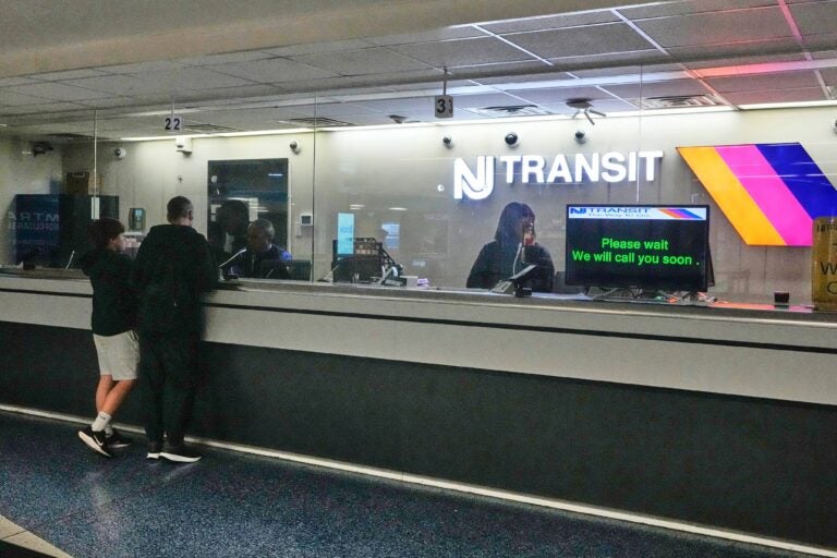 NJ-Transit-2025-05-16-tickets People stand at the train ticket counter of NJ Transit at Penn Station