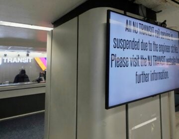 a sign reads All NJ TRANSIT rail service is suspended due to the engineer strike. Please visit the NJ TRANSIT website for further information.