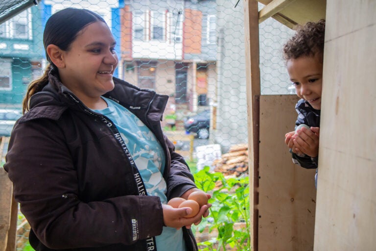 Maria Alaya and Nicholas at their chicken farm