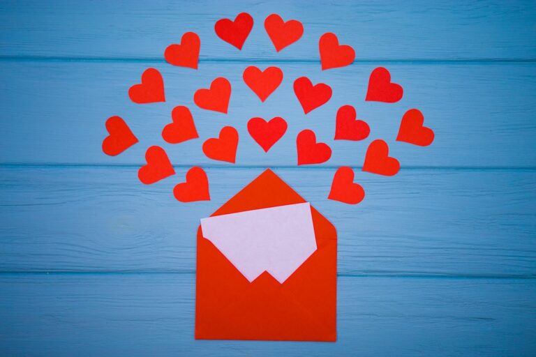 bigstock–224925937 Red hearts emerging from a red envelope. (Bigstock Image)