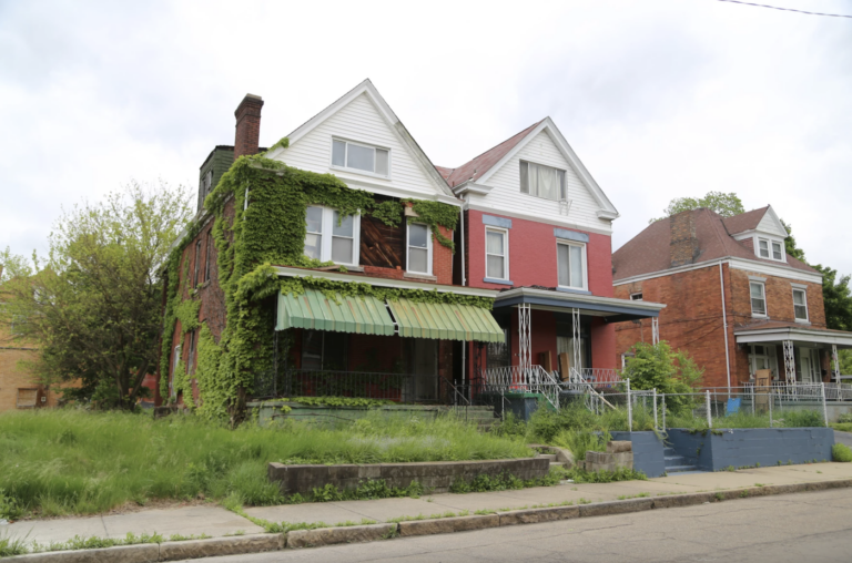 blight-home-wesa-2025-05-30 Blighted property with an overgrown lawn