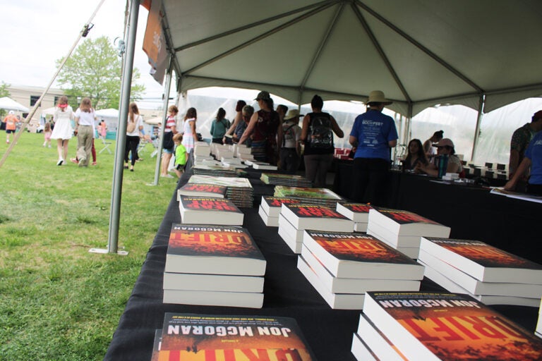 Hundreds of people attended the main event of the seventh annual Bucks County Book Festival on Saturday, May 3, 2025, at Broad Commons Park in Doylestown. (Emily Neil/WHYY)