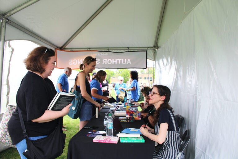 More than 40 authors participated in panels and signed books at the Bucks County Book Festival on Saturday, May 3, 2025, at Broad Commons Park in Doylestown. (Emily Neil/WHYY)