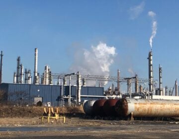 Smoke billowing from the oil refinery