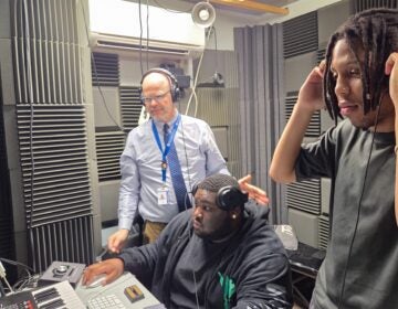 Students in the recording studio with their teacher
