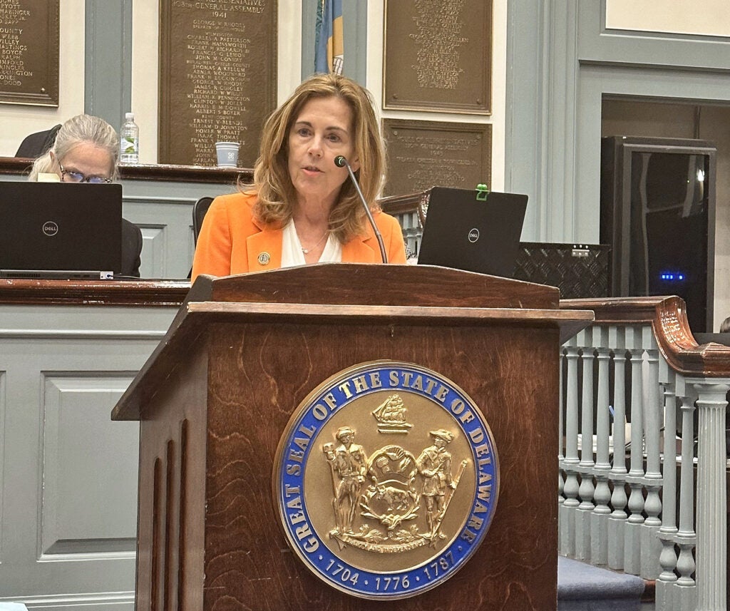 Kathy Jennings speaking at a podium