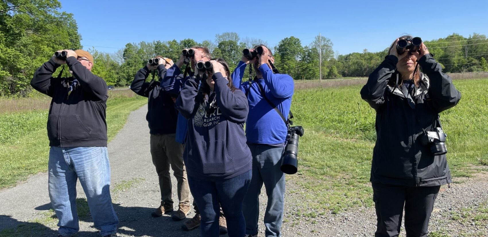The Birders of Central New Jersey at the World Series of Birding looking through binoculars