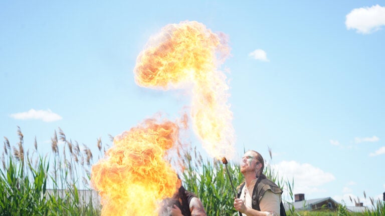 philadelphia_ren_fair6 Bella GreenWolf and Daniel GreenWolf breathe fire to cap off their performance. (Kenny Cooper/WHYY)