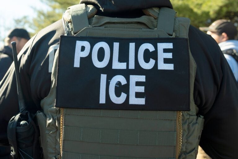 police-ice-agent-file the back of A U.S. Immigration and Customs Enforcement officer