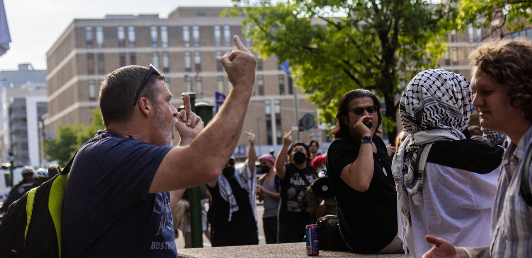06 10 2025 k paynter ice protest trump deportations detaining immigrants-5 A pedestrian clashes with protesters against ICE raids Federal Detention Center on Arch Street in Philadelphia on June 10, 2025.