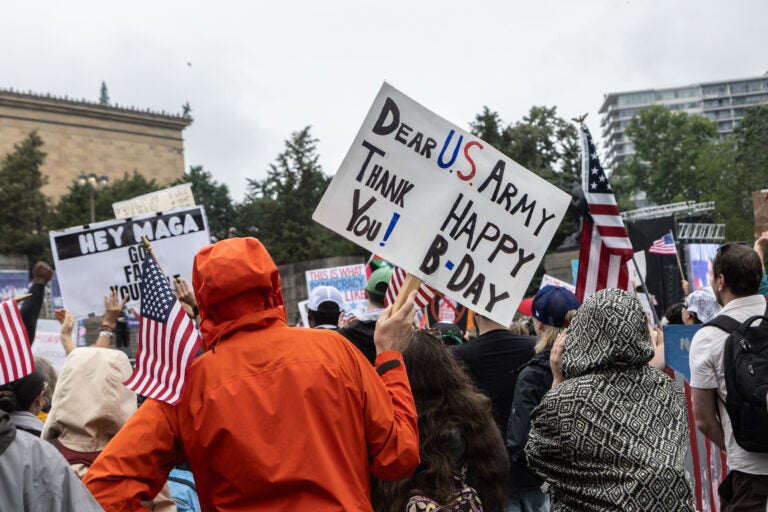 Protesters waved American flags at the Philadelphia Museum of Art during the No Kings protest on June 16, 2024. (Kimberly Paynter/WHYY)