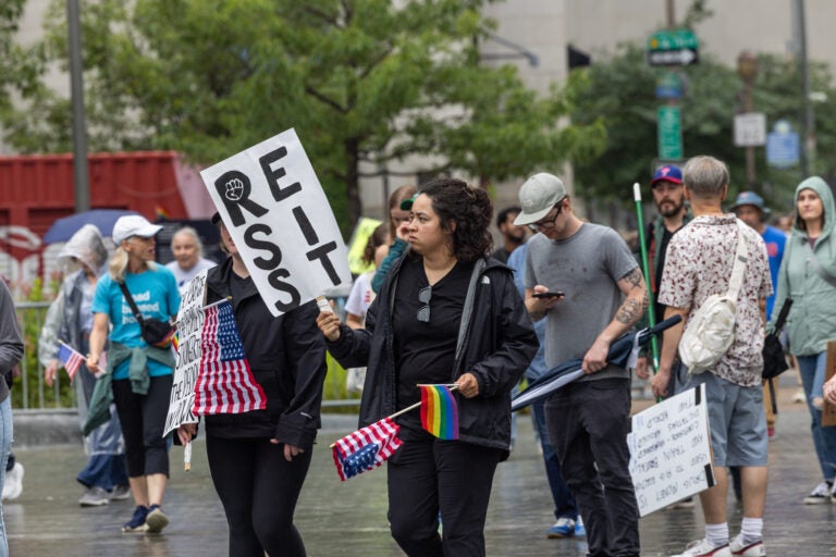 People in Center City Philadelphia gathered to protest the Trump administration’s agenda on June 14, 2025. (Kimberly Paynter/WHYY)