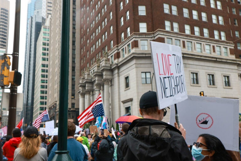 Protesters gathered at Love Park in Philadelphia ahead of the No Kings March and rally on June 14, 2025. (Kimberly Paynter/WHYY)
