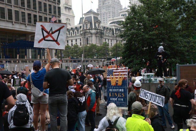 Protesters gathered at Love Park in Philadelphia ahead of the No Kings March and rally on June 14, 2025. (Kimberly Paynter/WHYY)