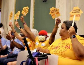 Members of OnePA Renters United Philadelphia hold signs reading SAFE HEALTHY HOMES and PROTECT RENTERS! VOTE YES