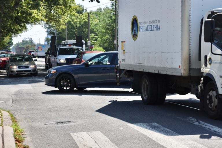 A motorist turns left from Baltimore Avenue onto 58th Street
