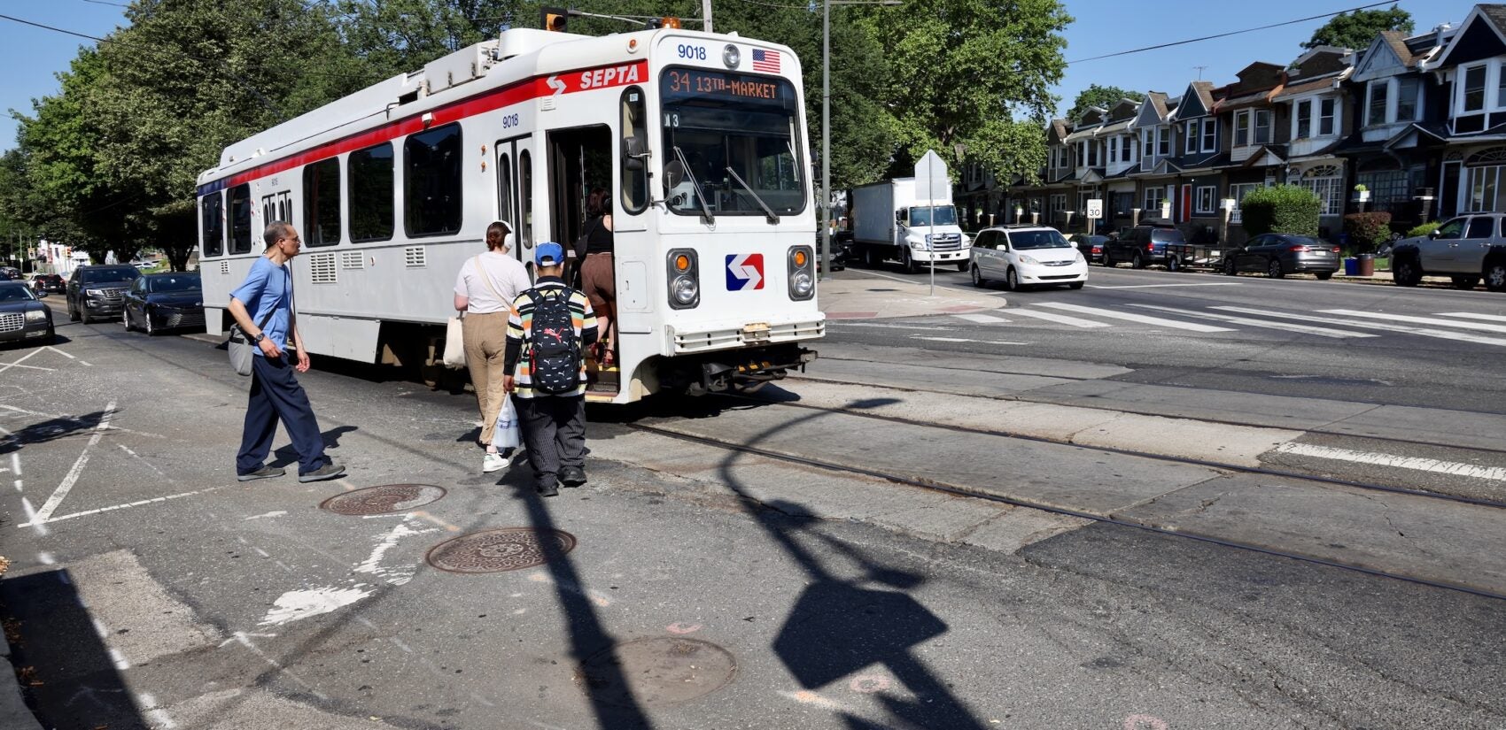 2025 06 25-e lee-philadelphia cobbs creek-dangerous intersection trolley pedestrians people board a trolley at the intersection of Baltimore Avenue, Cobbs Creek Parkway and 58th Street
