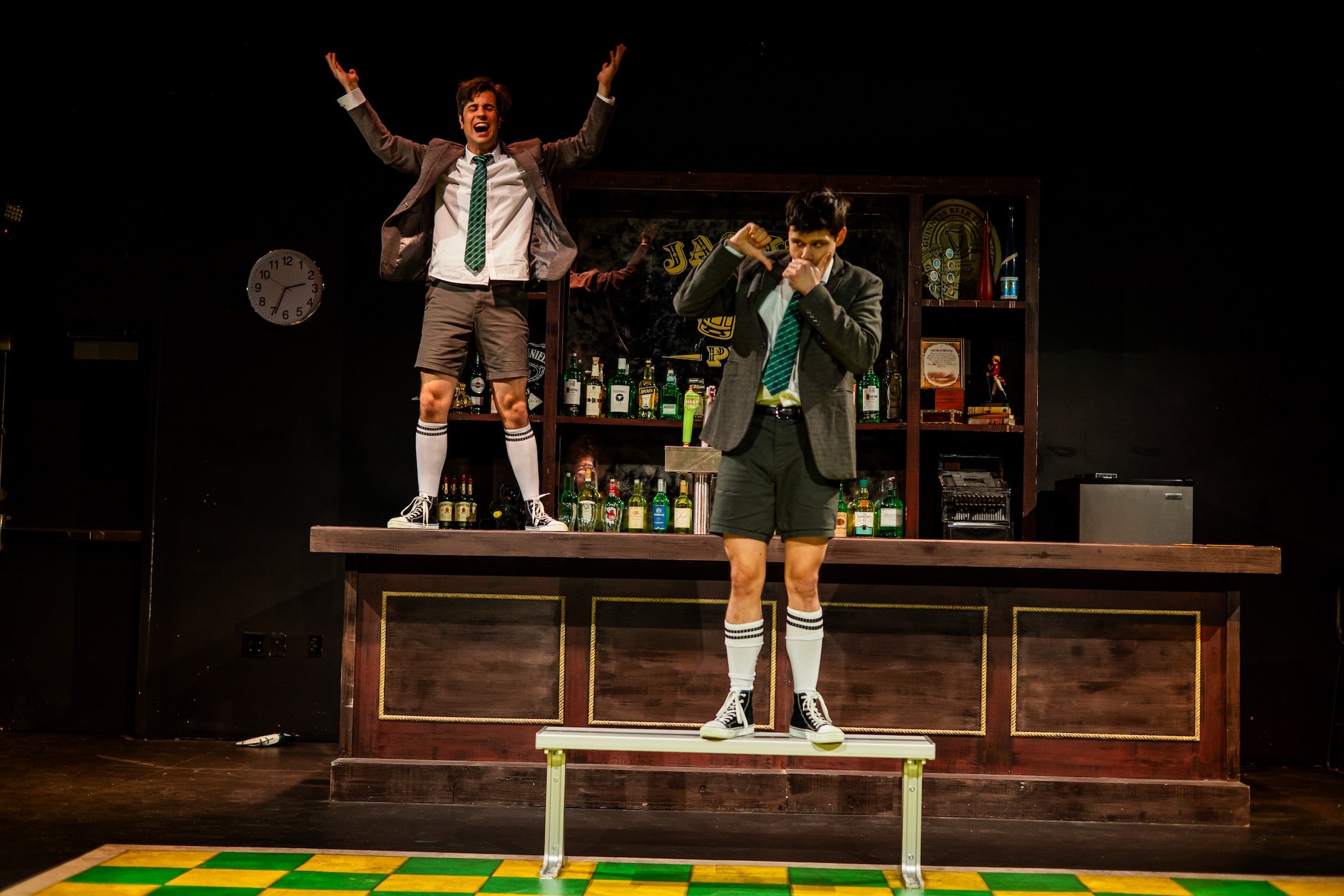 Two actors on stage during a performance