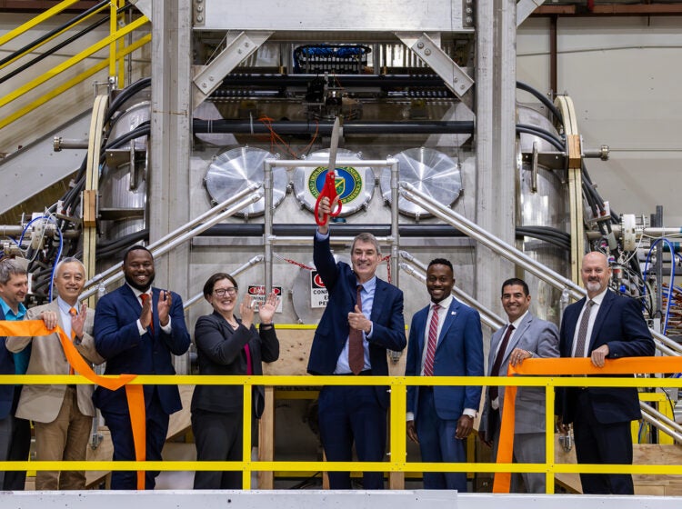 Officials at the ribbon cutting in the lab.