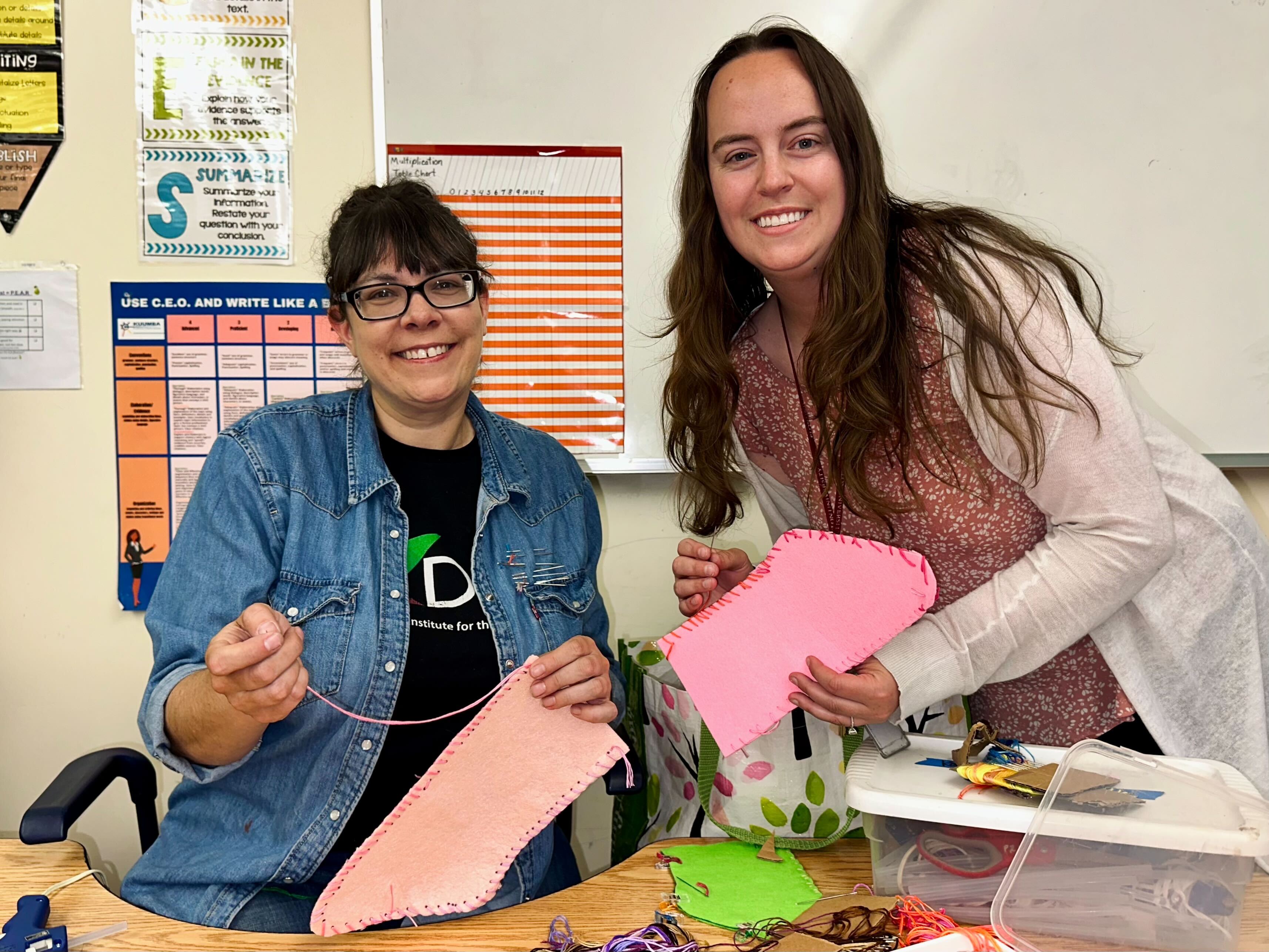 Kuumba Academy's Kate Testa and Emma Salisbury smile